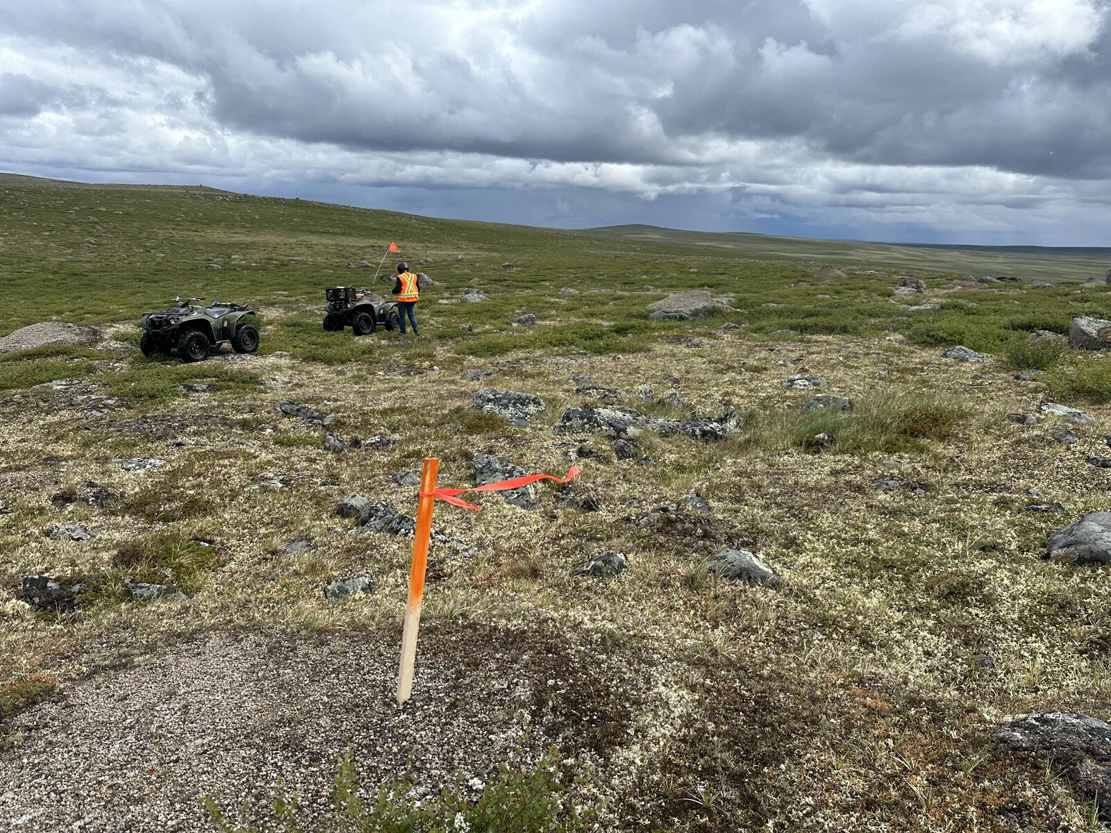 Survey crew with ATVs on summer tundra